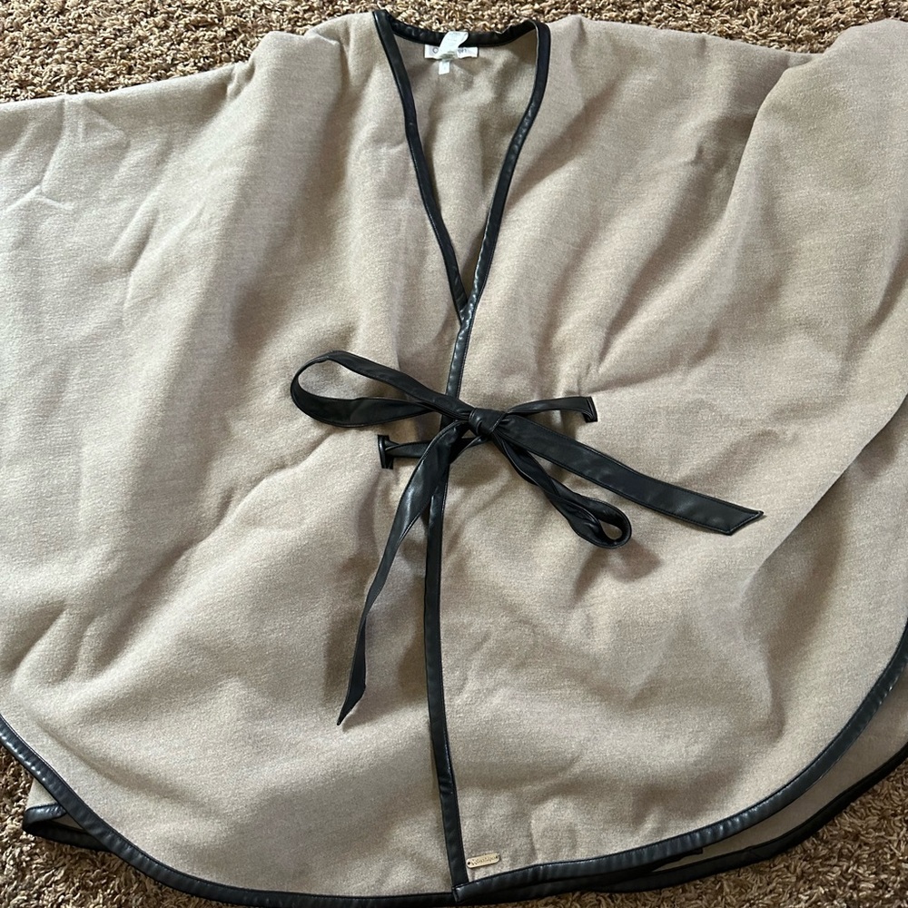 Like new Calvin Klein beige and black lined sweater cape